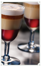 The Cafe Royal is made by layering Chambord liqueur, Irish cream, hazelnut liqueur and orange liqueur in a chilled shot glass.