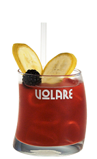 The Mexican Monkey is a fun red drink recipe made from Volare Banana liqueur, tequila, sweet and sour mix and blackberries, and served over ice in a rocks glass garnished with banana slices and blackberry.