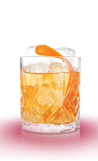 The Old Fashioned cocktail is a classic orange colored drink made from Mandarine Napoleon orange liqueur, bourbon and bitters, and served over ice in a rocks glass.