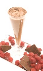 The Raspberry Dream cocktail recipe is a beautiful and flavorful dessert drink made from Leblon cachaca, raspberry liqueur, chocolate syrup, milk and raspberries, and served in a chilled glass.