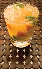 The Tangerine Honey Caipirinha is an exotic variation of the classic Brazilian caipirinha drink recipe. An orange colored cocktail made from Leblon cachaca, tangerine, lime and honey, and served muddled in a rocks glass.