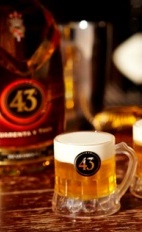 The 43 Mini Beer drink recipe is perfect for a football game or tailgate party. Made from Licor 43 and heavy cream, and served shot glasses.