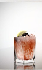 The Bramble Vine is a red colored drink recipe bringing together the aromatic flavors of summer. Made from G'Vine Nouaison, crème de cassis, lemon juice and simple syrup, and served over ice in a rocks glass.