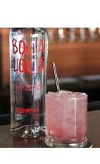 The Cana de Bacco drink recipe is made from Boca Loca cachaca, Espirit de June liqueur, cranberry juice and club soda, and served over ice in a rocks glass.