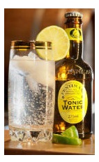 The Gin and Tonic Supreme drink recipe is made from Okanagan gin and tonic water, and served over ice in a highball glass garnished with a lime slice.
