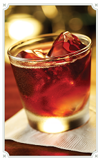 The Kentucky Swap drink is made from Chambord raspberry liqueur, Southern Comfort liqueur, bourbon, white cranberry juice, gingerbread syrup and ginger ale, and served in a rocks glass over ice.