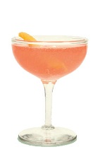 The Nomayo is a peach colored cocktail made from gin, St-Germain elderflower liqueur, Aperol, lemon juice and champagne, and served in a chilled cocktail glass.