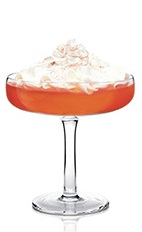The Pumpkin-tini is a spicy orange Halloween drink made from Frangelico hazelnut liqueur, golden rum, simple syrup, pumpkin spice, vanilla vodka, whipped cream and cinnamon, and served in a chilled cocktail glass.