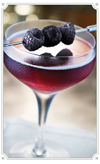 The Sweet Taste of Victory cocktail is made from Chambord raspberry liqueur, bourbon, vanilla syrup and bitters, and served in a chilled cocktail glass.