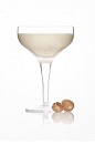 The Alexander cocktail is a classic cream colored cocktail made from Caorunn gin, milk, white crème de cacao and cream, and served in a chilled cocktail glass.