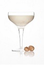 The Alexander cocktail is a classic cream colored cocktail made from Caorunn gin, milk, white crème de cacao and cream, and served in a chilled cocktail glass.