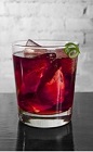 The Amazoni drink recipe is a dark red colored cocktail made from Cedilla acai liqueur, gin and Campari, and served over ice in a rocks glass.