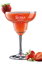 The Strawberry Sierra Margarita is a perfectly balanced red colored margarita made from Sierra tequila, lime juice, agave nectar and strawberries, and served in a chilled margarita glass.