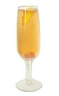 The Gentleman is an orange colored cocktail made from cognac, St-Germain elderflower liqueur, brown sugar, bitters and chilled champagne, and served in a chilled champagne glass.