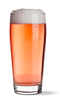 The Shandy cocktail recipe is an amber colored drink made from UV Lemonade vodka and light beer, and served in a chilled beer glass.