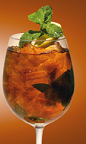 The Xantea cocktail recipe is made from Xante cognac, Earl Grey tea, mint and lemon, and served over ice in a stemmed glass.